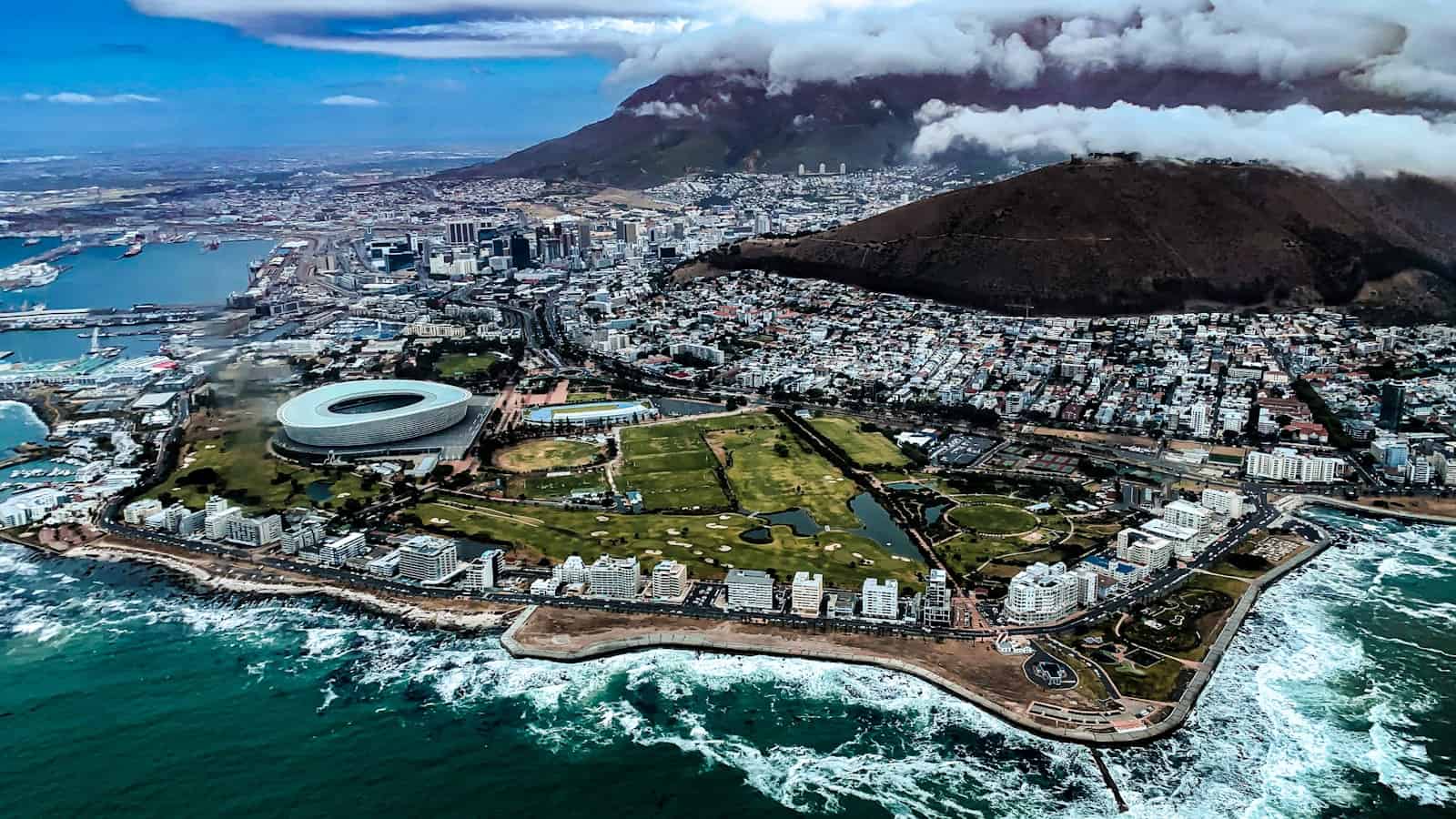 Table Mountain under its tablecloth above the city, Cape Town