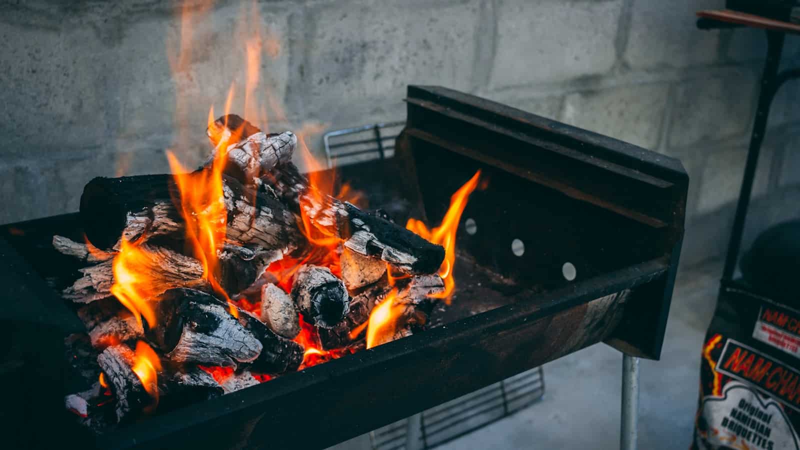 Wood coals glowing in a braai